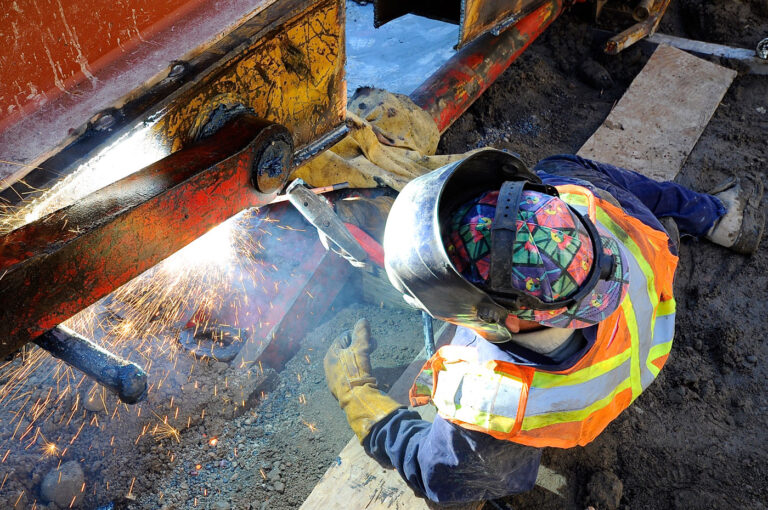 Welder working on the Women's College Hospital demolition project